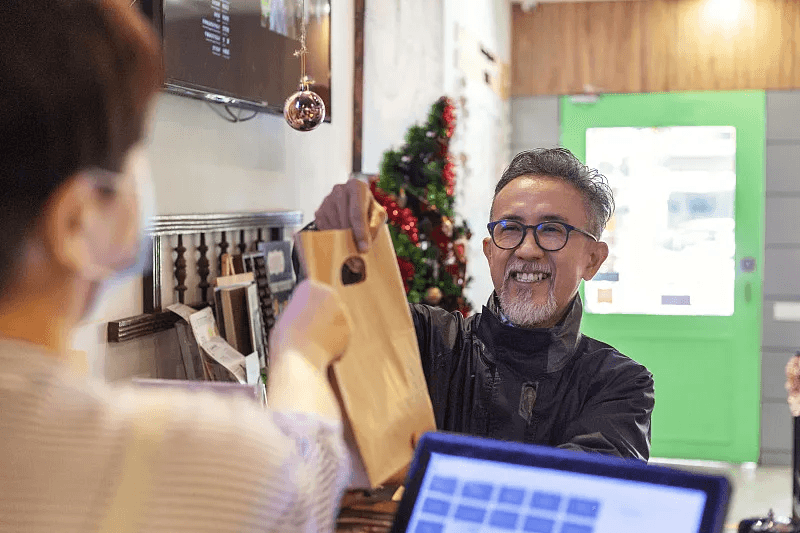 Customer collecting a prepared takeaway order