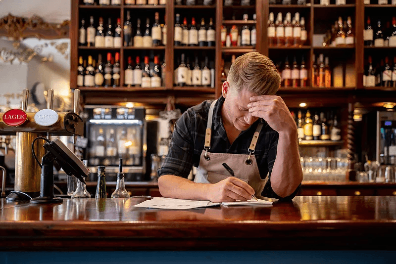 Restaurant operator managing daily business administration