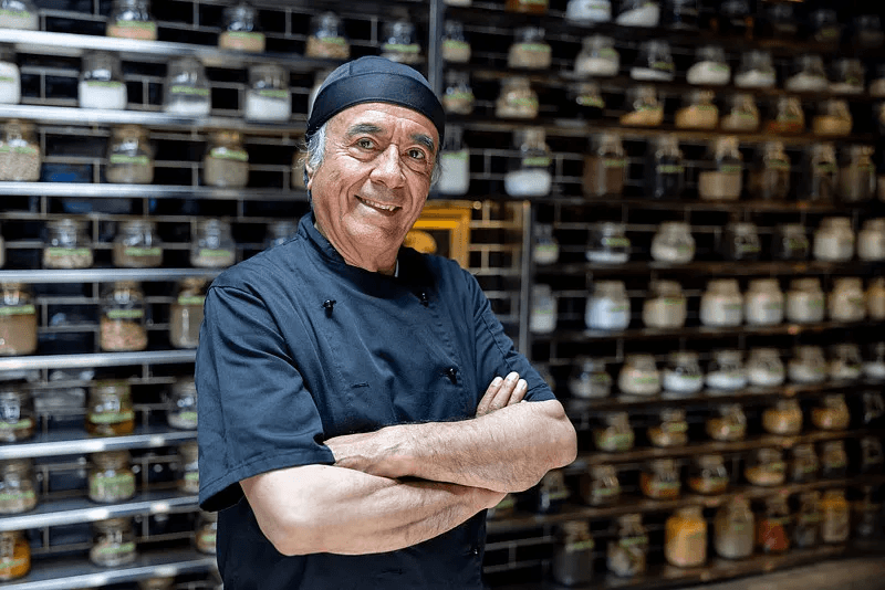 Chef standing in an organised ingredient store