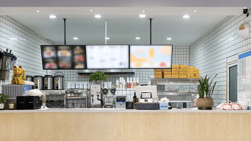 A quick-service restaurant counter prepared for customer orders