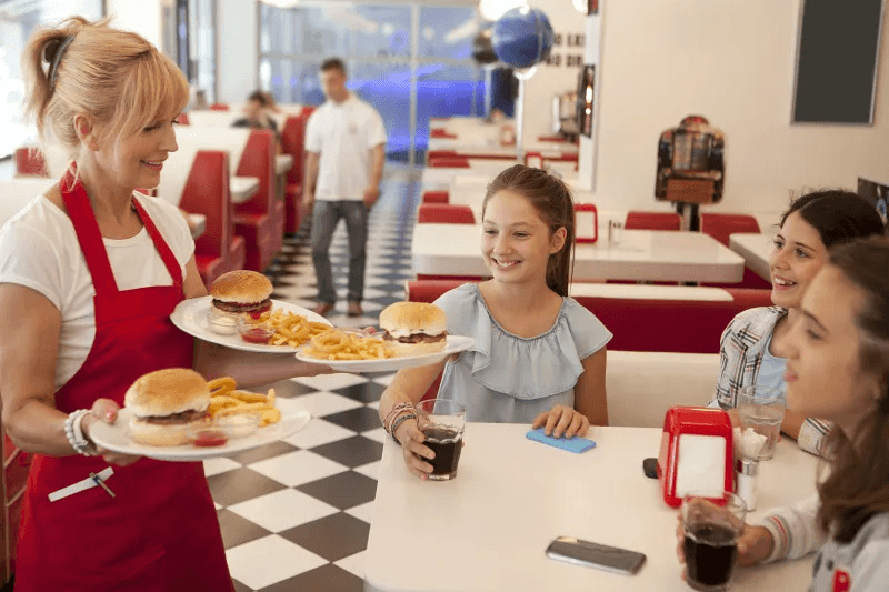 Meals being served to guests inside a quick-service restaurant